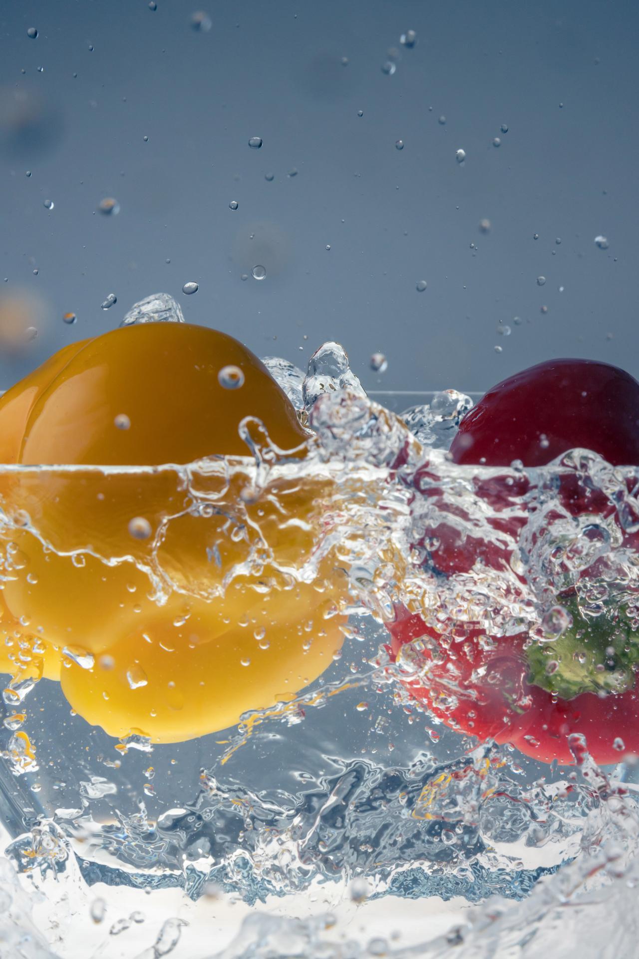 European Photography Awards Winner - Red and yellow pepper falling into water